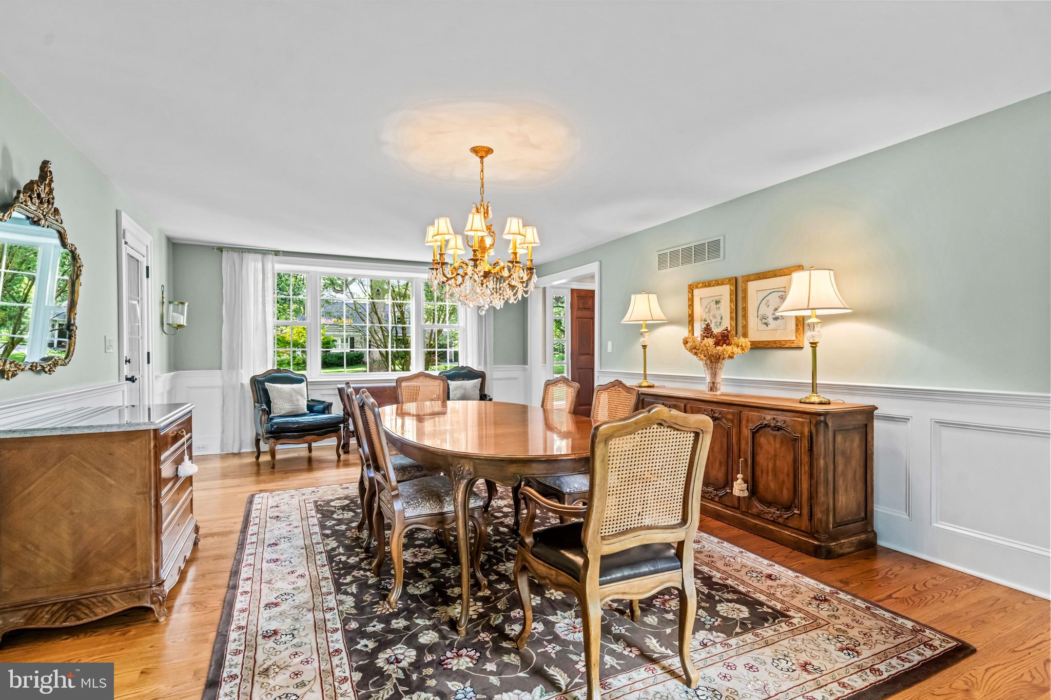 113 Deepdale Road Wayne, PA 19087 - Photo 10 of 68 a dining room with furniture a chandelier and wooden floor