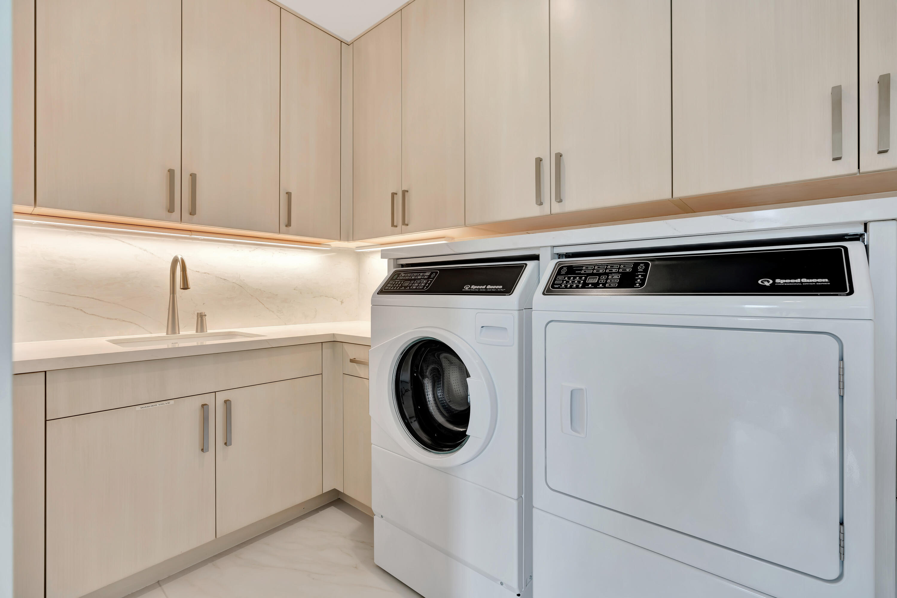 461 Venus Drive, Unit B Juno Beach, FL 33408 - Photo 29 of 85 a utility room with sink dryer and washer