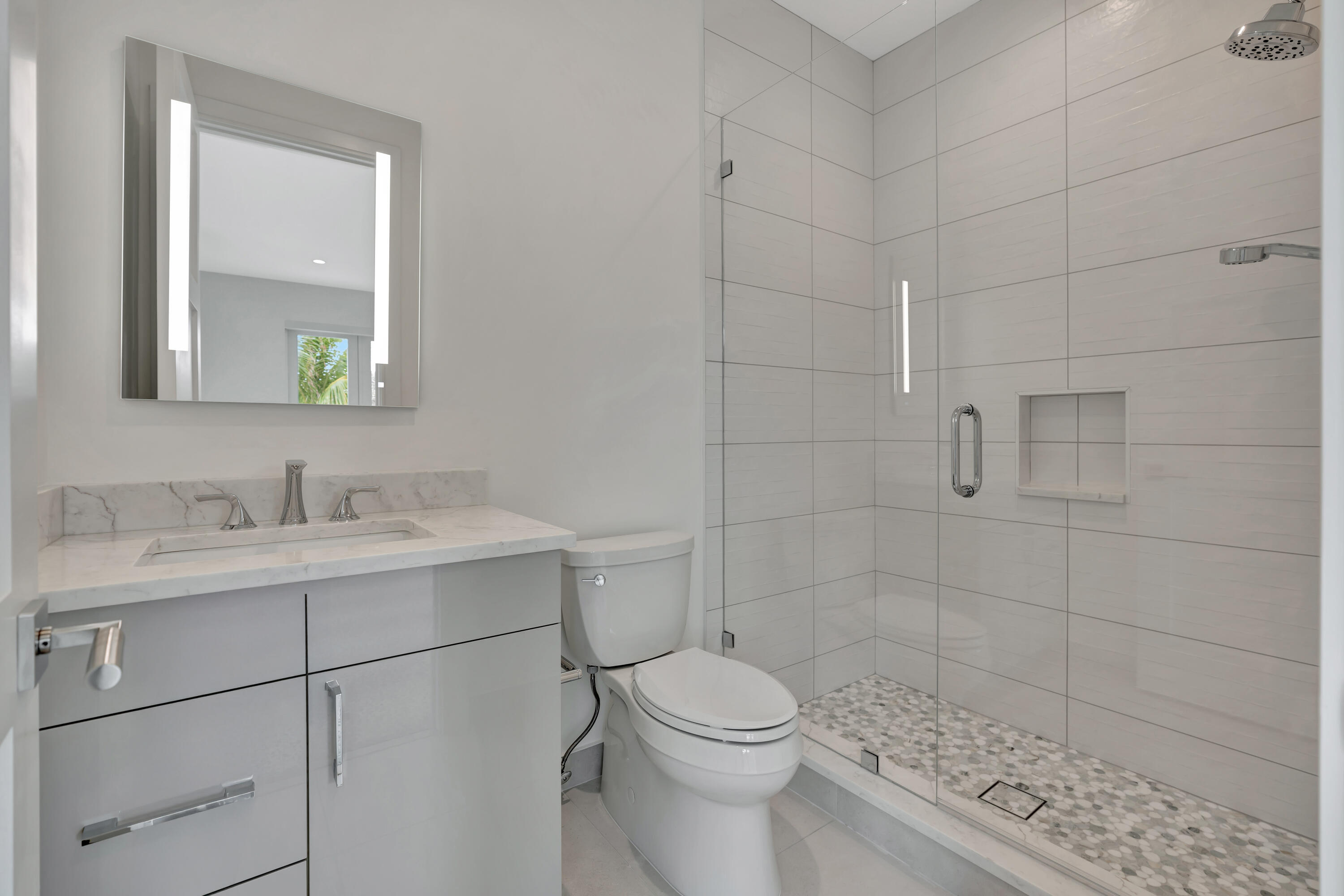 461 Venus Drive, Unit B Juno Beach, FL 33408 - Photo 31 of 85 a bathroom with a sink toilet and shower