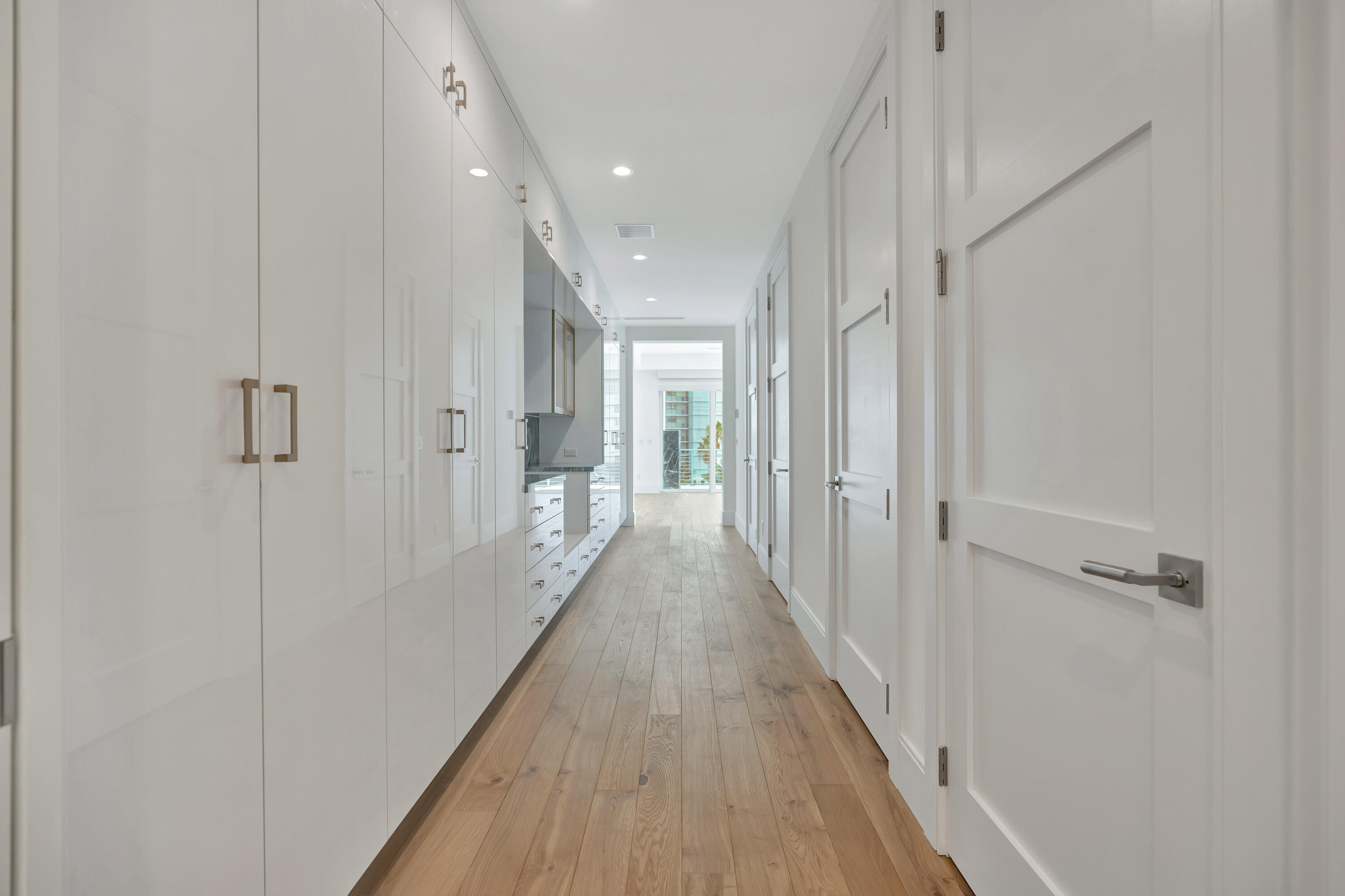 461 Venus Drive, Unit B Juno Beach, FL 33408 - Photo 45 of 85 a view of a hallway with wooden floor and staircase