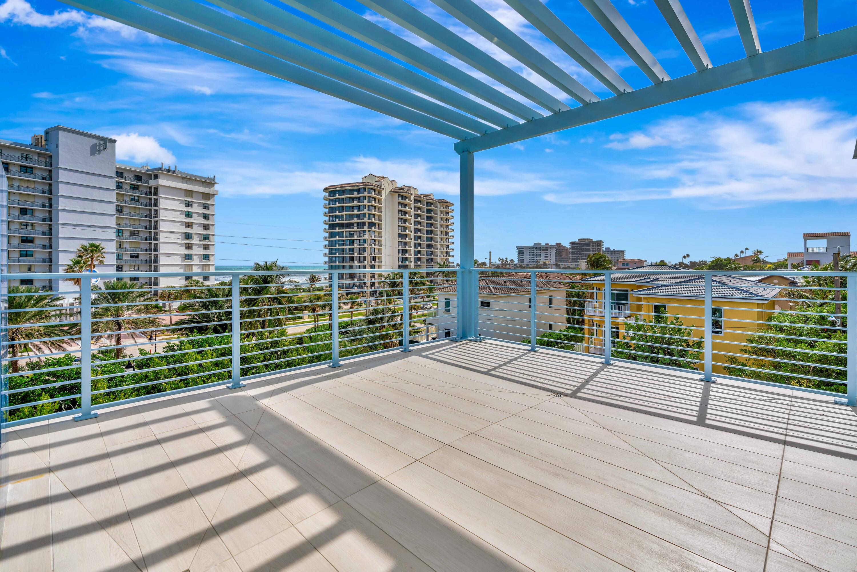 461 Venus Drive, Unit B Juno Beach, FL 33408 - Photo 59 of 85 a view of a balcony with city view