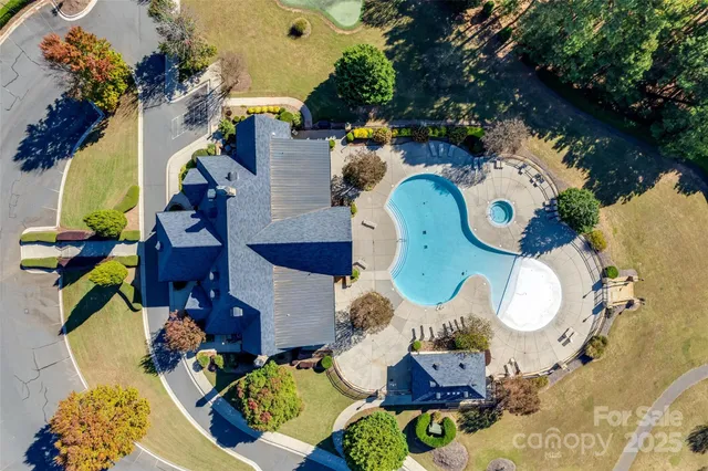 an aerial view of a house with swimming pool