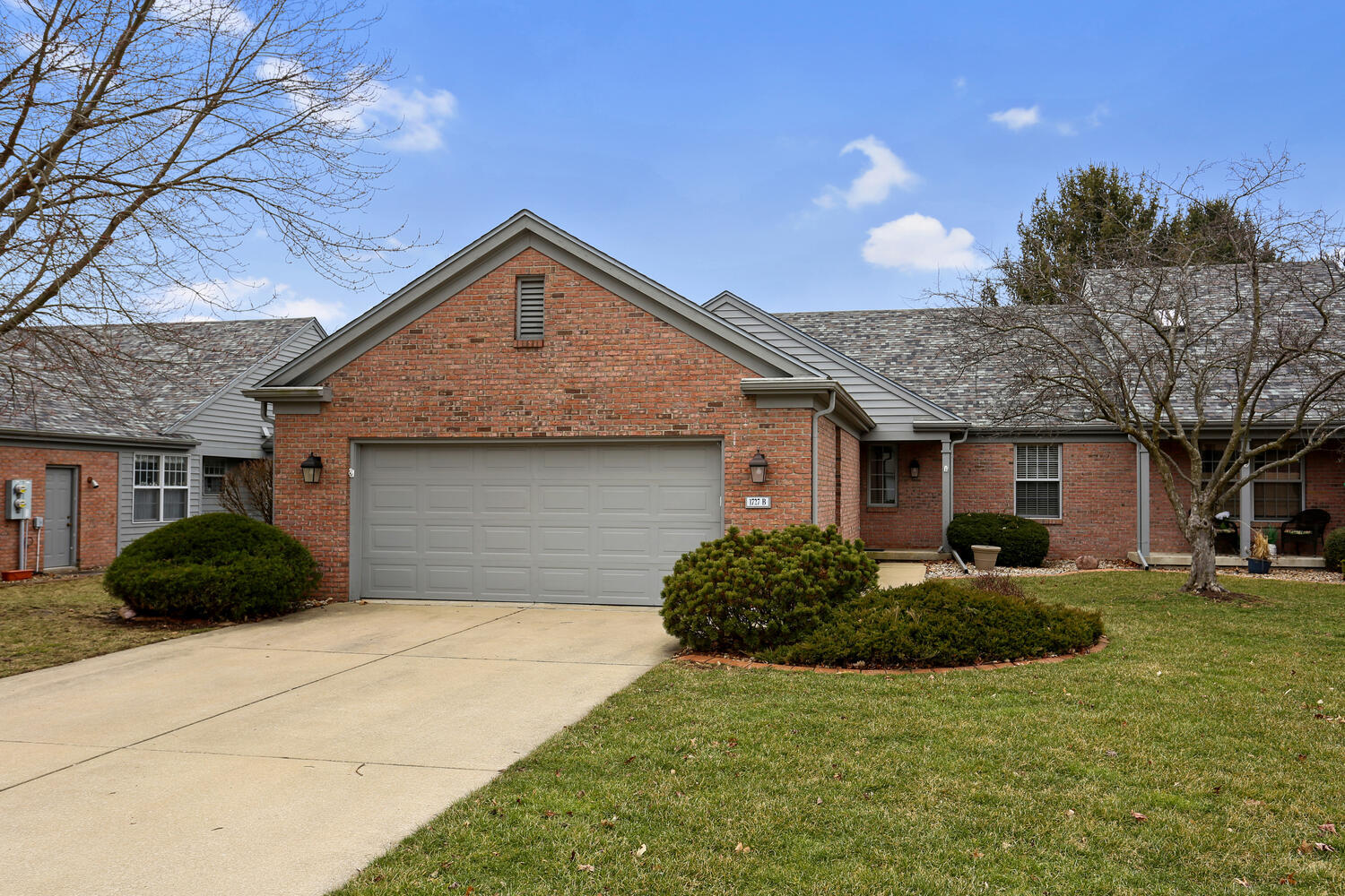 1727 Lakeside Drive, Unit B Champaign, IL 61821 - Photo 1 of 35 a front view of a house with garden