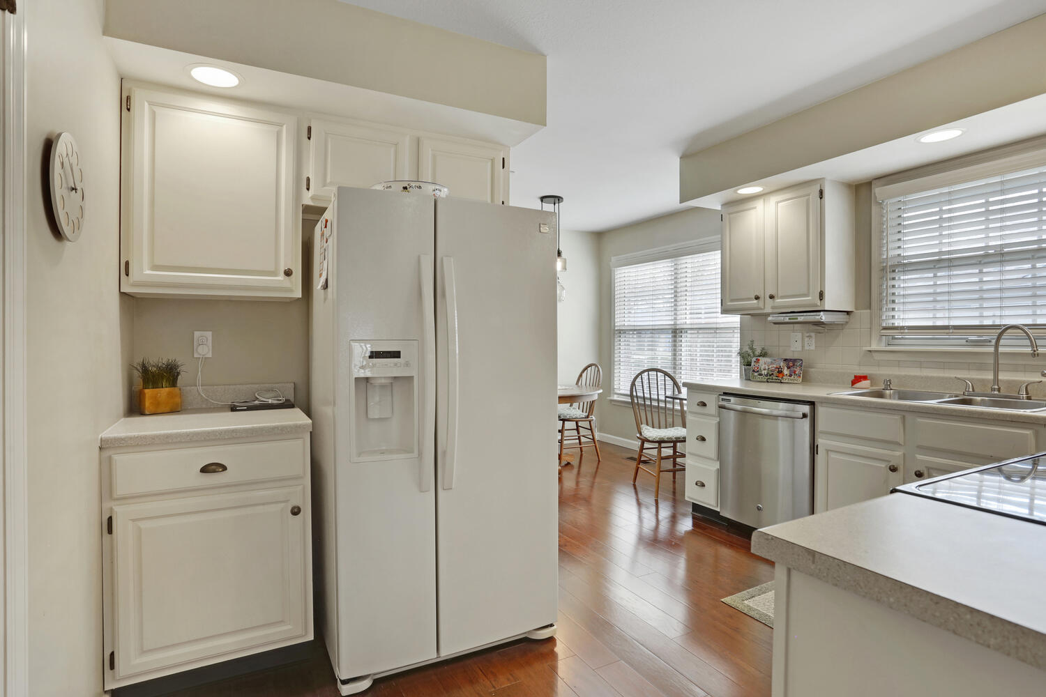 1727 Lakeside Drive, Unit B Champaign, IL 61821 - Photo 13 of 35 a kitchen with a refrigerator a sink and cabinets