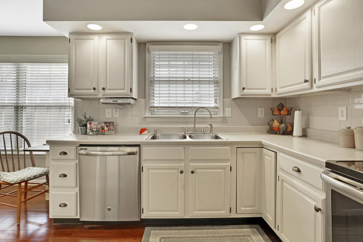 1727 Lakeside Drive, Unit B Champaign, IL 61821 - Photo 14 of 35 a kitchen with white cabinets and sink