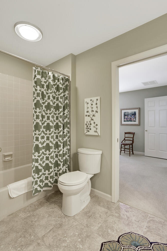 1727 Lakeside Drive, Unit B Champaign, IL 61821 - Photo 25 of 35 a bathroom with a toilet and a shower