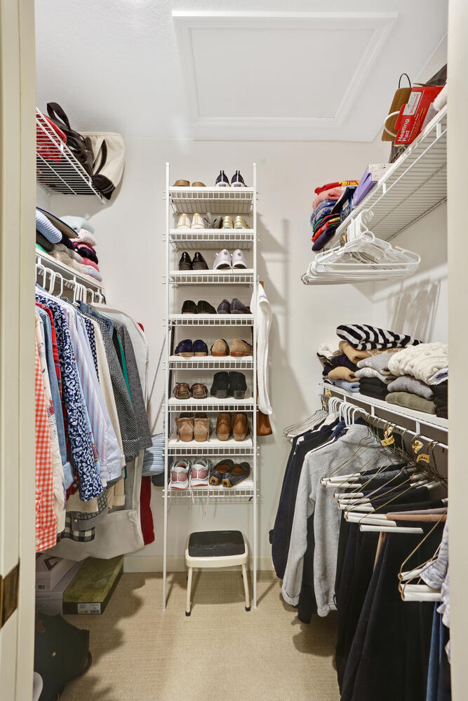1727 Lakeside Drive, Unit B Champaign, IL 61821 - Photo 31 of 35 a view of walk in closet with clothes and shoes
