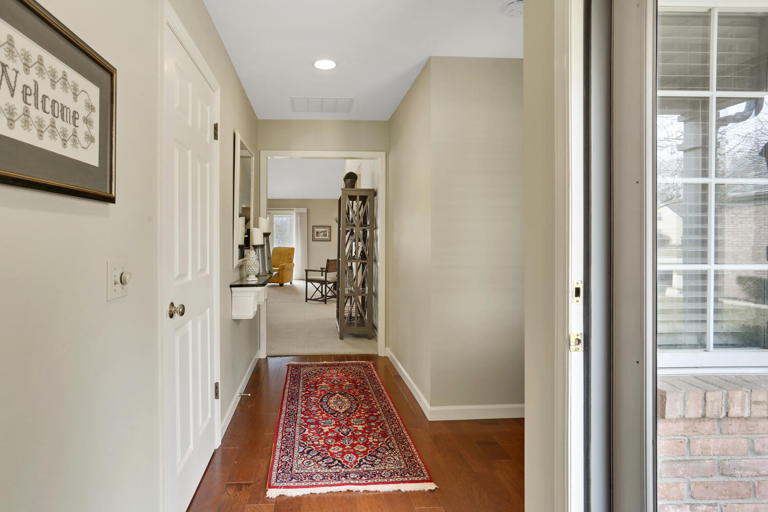 1727 Lakeside Drive, Unit B Champaign, IL 61821 - Photo 4 of 35 a view of hallway with a rug and a floor to ceiling window