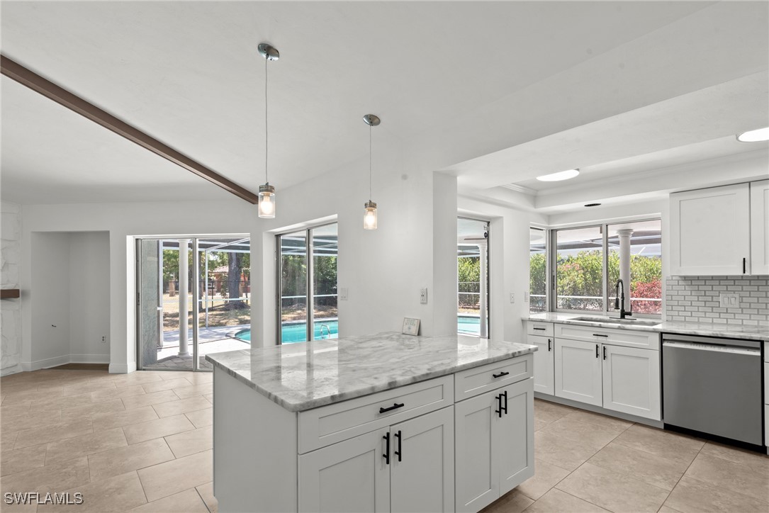 12331 McGregor Boulevard Fort Myers, FL 33919 - Photo 11 of 46 a kitchen with granite countertop a sink and white cabinets