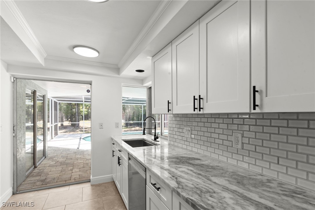 12331 McGregor Boulevard Fort Myers, FL 33919 - Photo 15 of 46 a kitchen with stainless steel appliances granite countertop a sink and cabinets
