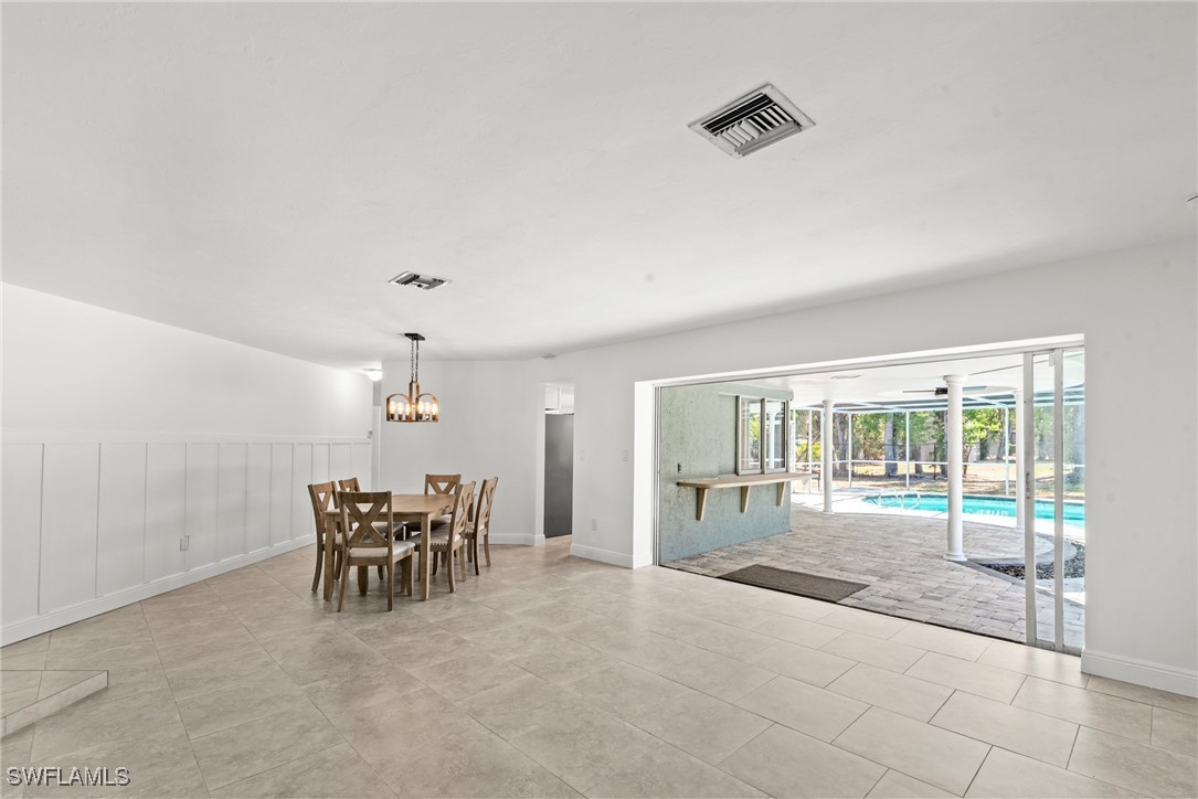 12331 McGregor Boulevard Fort Myers, FL 33919 - Photo 18 of 46 a view of a livingroom with furniture wooden floor and a rug