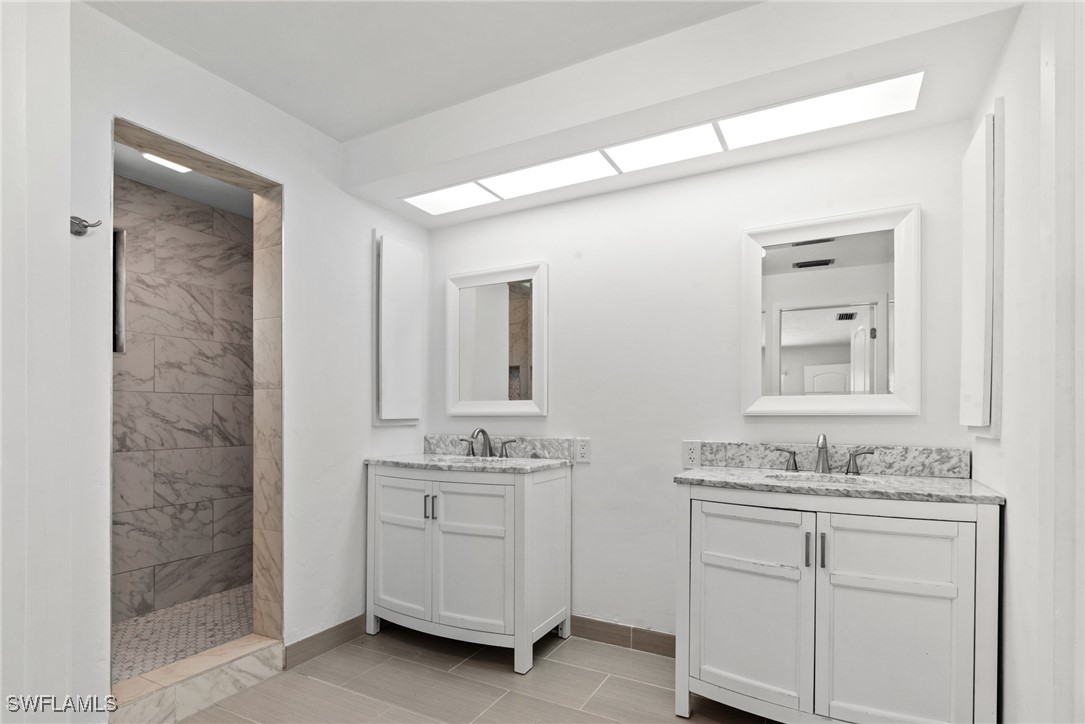 12331 McGregor Boulevard Fort Myers, FL 33919 - Photo 23 of 46 a bathroom with a sink and a mirror