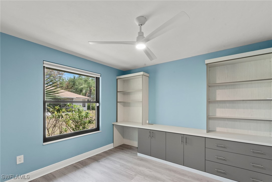 12331 McGregor Boulevard Fort Myers, FL 33919 - Photo 28 of 46 a view of an empty room with a window and wooden floor