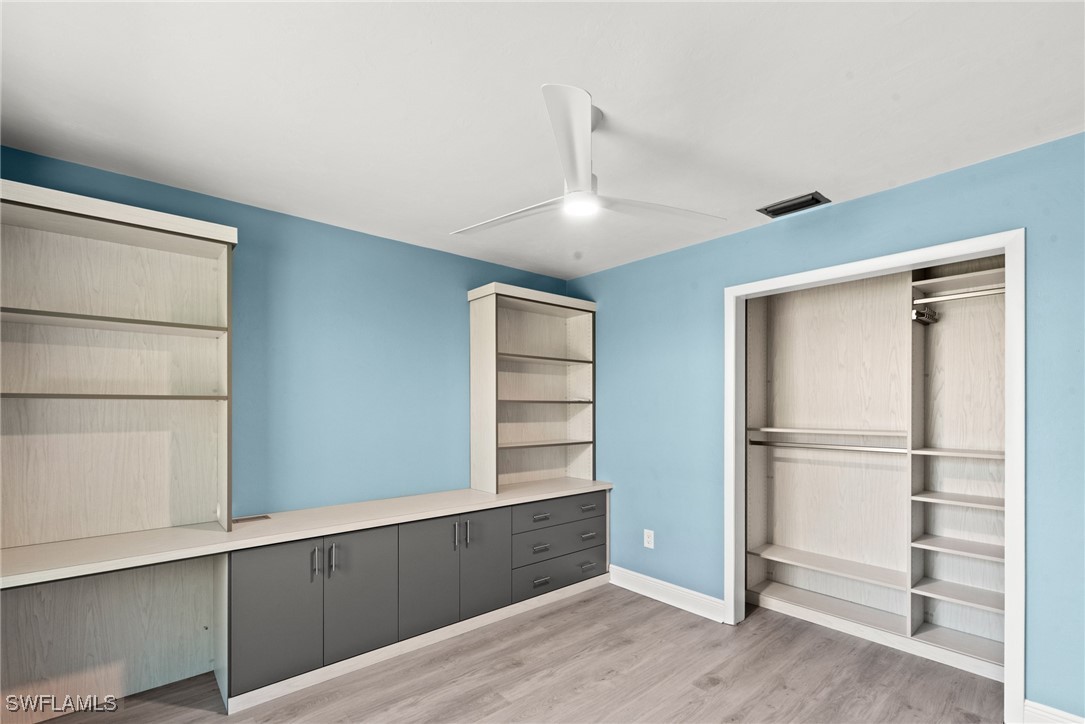 12331 McGregor Boulevard Fort Myers, FL 33919 - Photo 29 of 46 a view of an empty room with wooden floor and a window