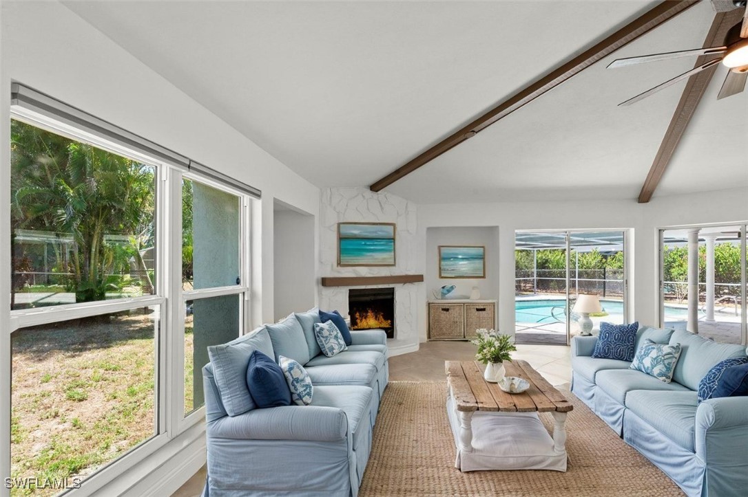 12331 McGregor Boulevard Fort Myers, FL 33919 - Photo 3 of 46 a living room with furniture fireplace and large windows