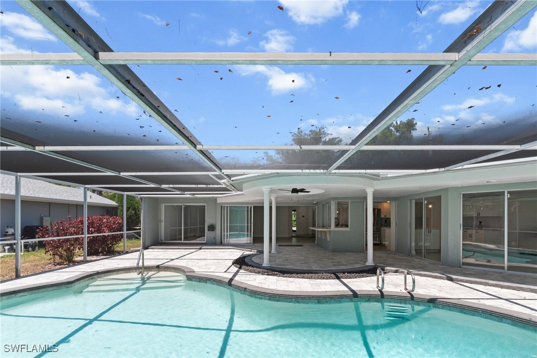 12331 McGregor Boulevard Fort Myers, FL 33919 - Photo 35 of 46 a view of a house with backyard porch and sitting area