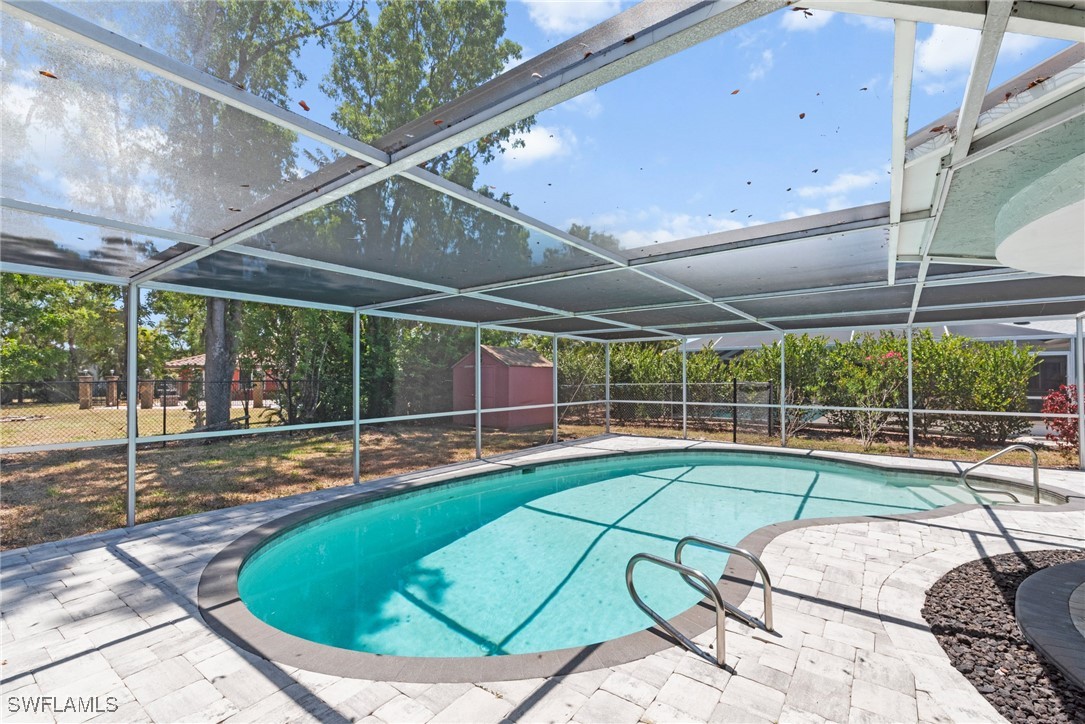 12331 McGregor Boulevard Fort Myers, FL 33919 - Photo 37 of 46 a view of a swimming pool with a patio