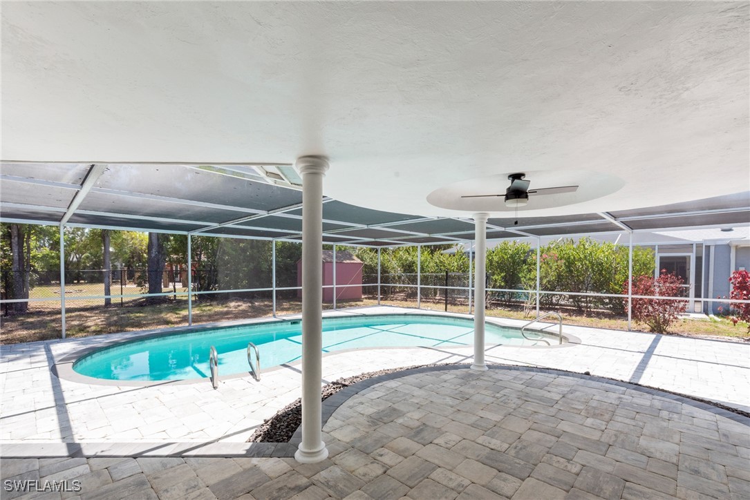 12331 McGregor Boulevard Fort Myers, FL 33919 - Photo 38 of 46 a view of a swimming pool with a patio and a yard