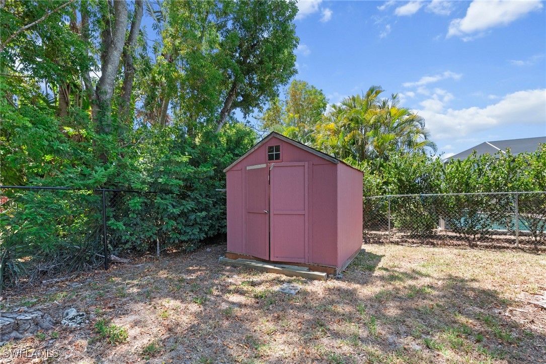 12331 McGregor Boulevard Fort Myers, FL 33919 - Photo 41 of 46 a view of barn with a small yard and large trees