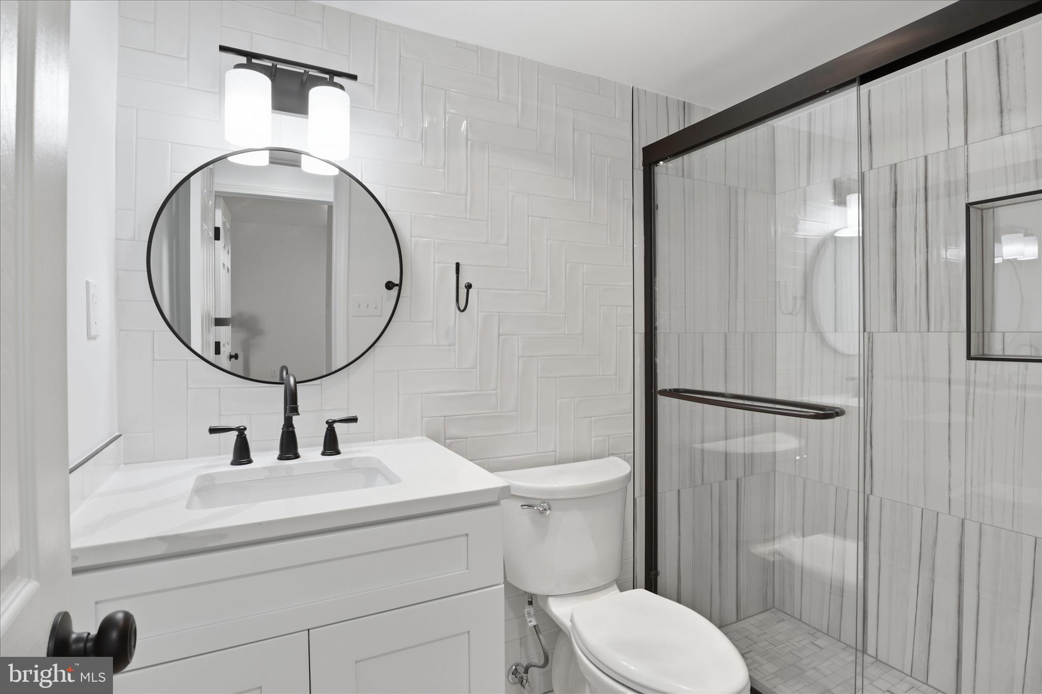 8300 Tobin Road, Unit 23 Annandale, VA 22003 - Photo 12 of 37 a bathroom with a sink toilet and shower