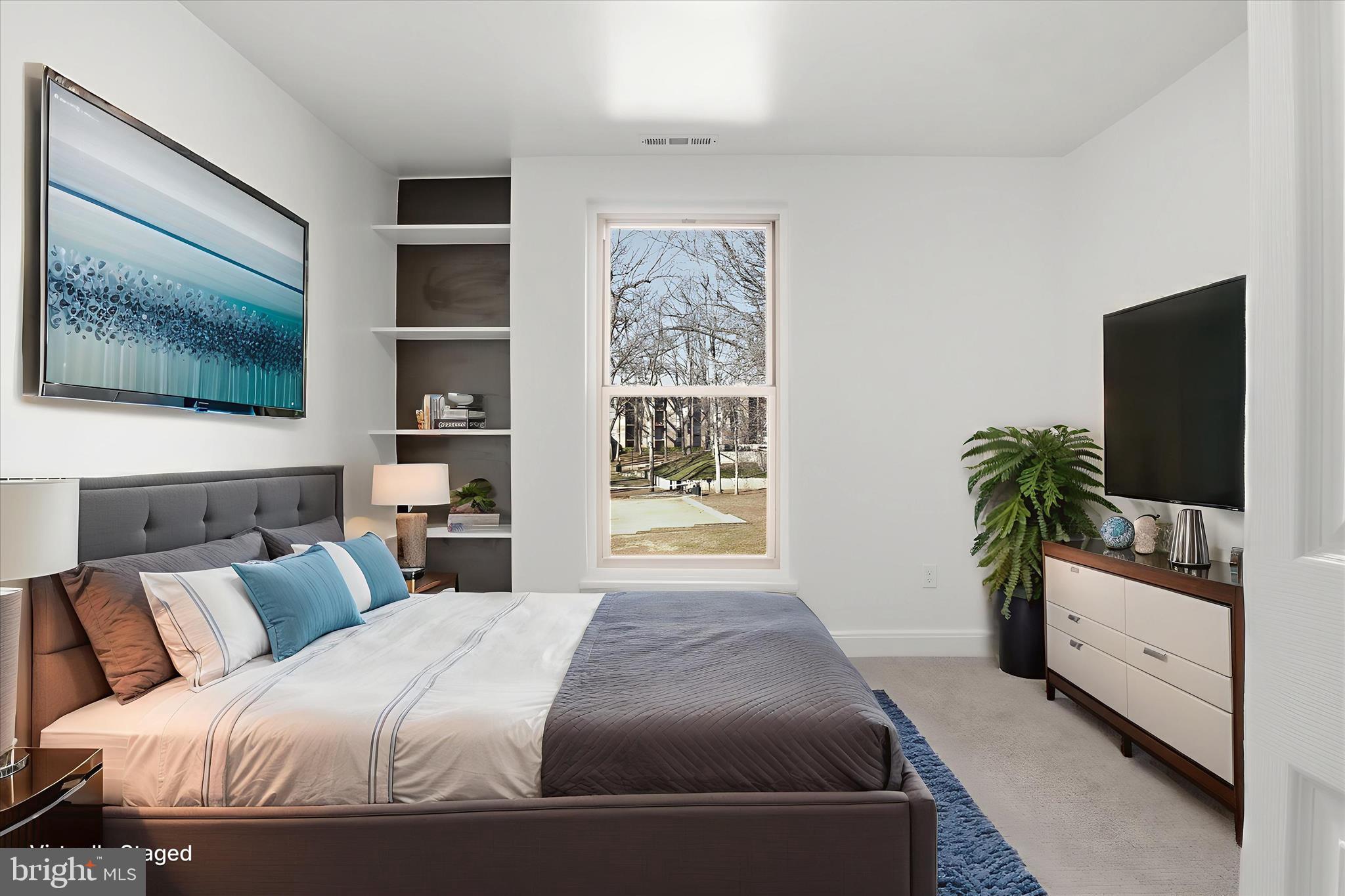 8300 Tobin Road, Unit 23 Annandale, VA 22003 - Photo 13 of 37 a bedroom with a bed and a flat screen tv