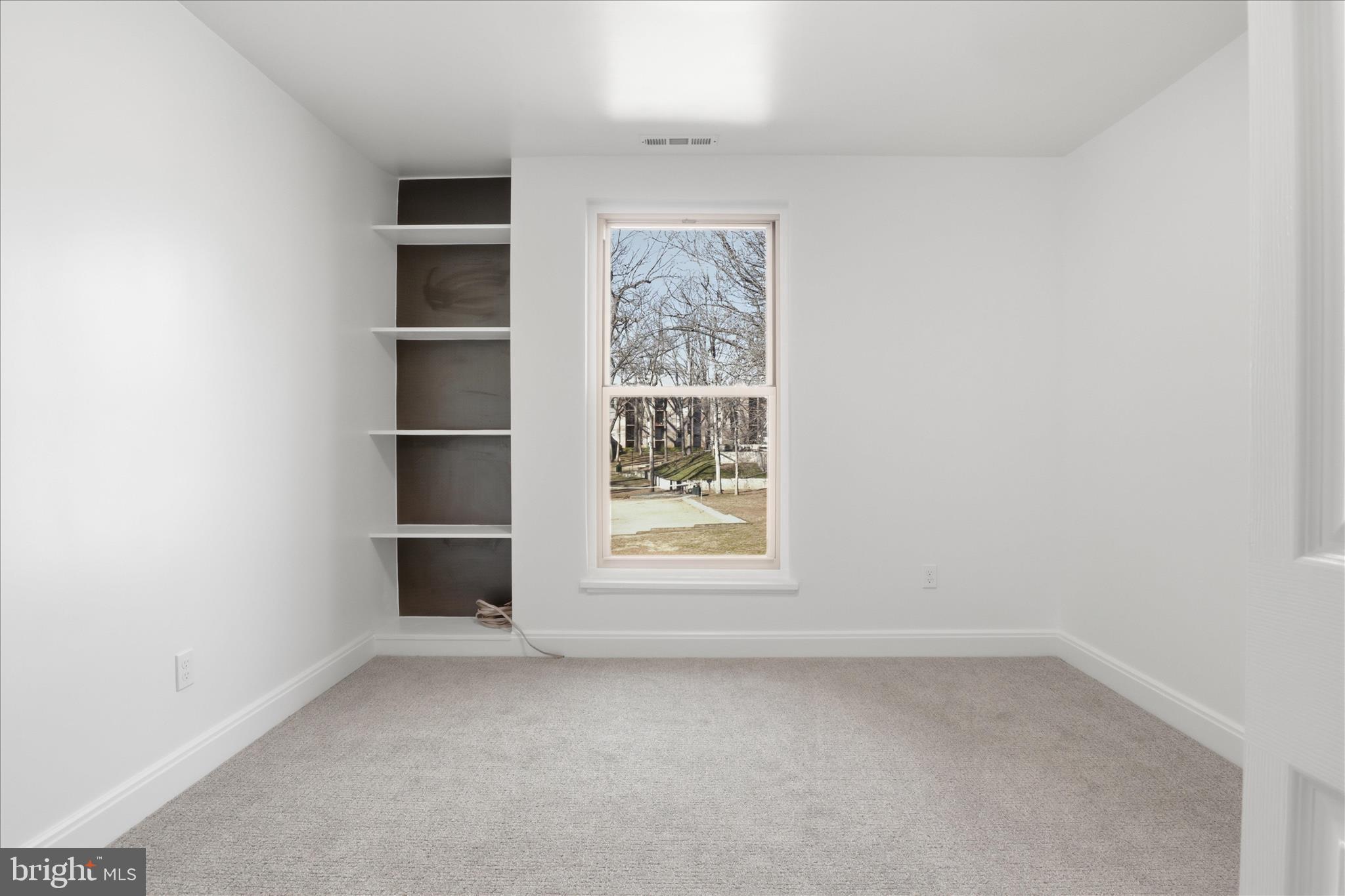 8300 Tobin Road, Unit 23 Annandale, VA 22003 - Photo 14 of 37 an empty room with a window and closet