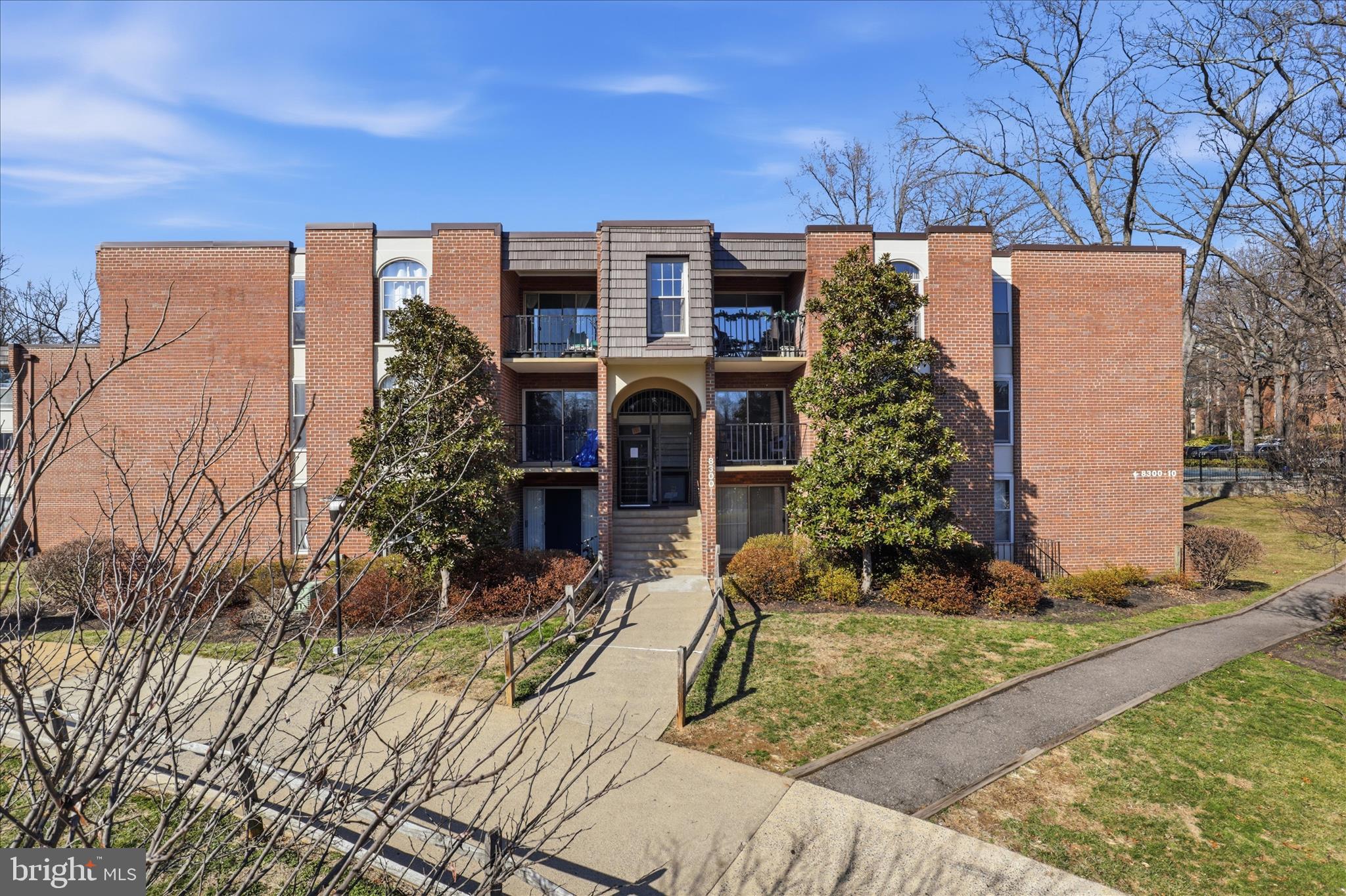 8300 Tobin Road, Unit 23 Annandale, VA 22003 - Photo 2 of 37 front view of a house with a yard