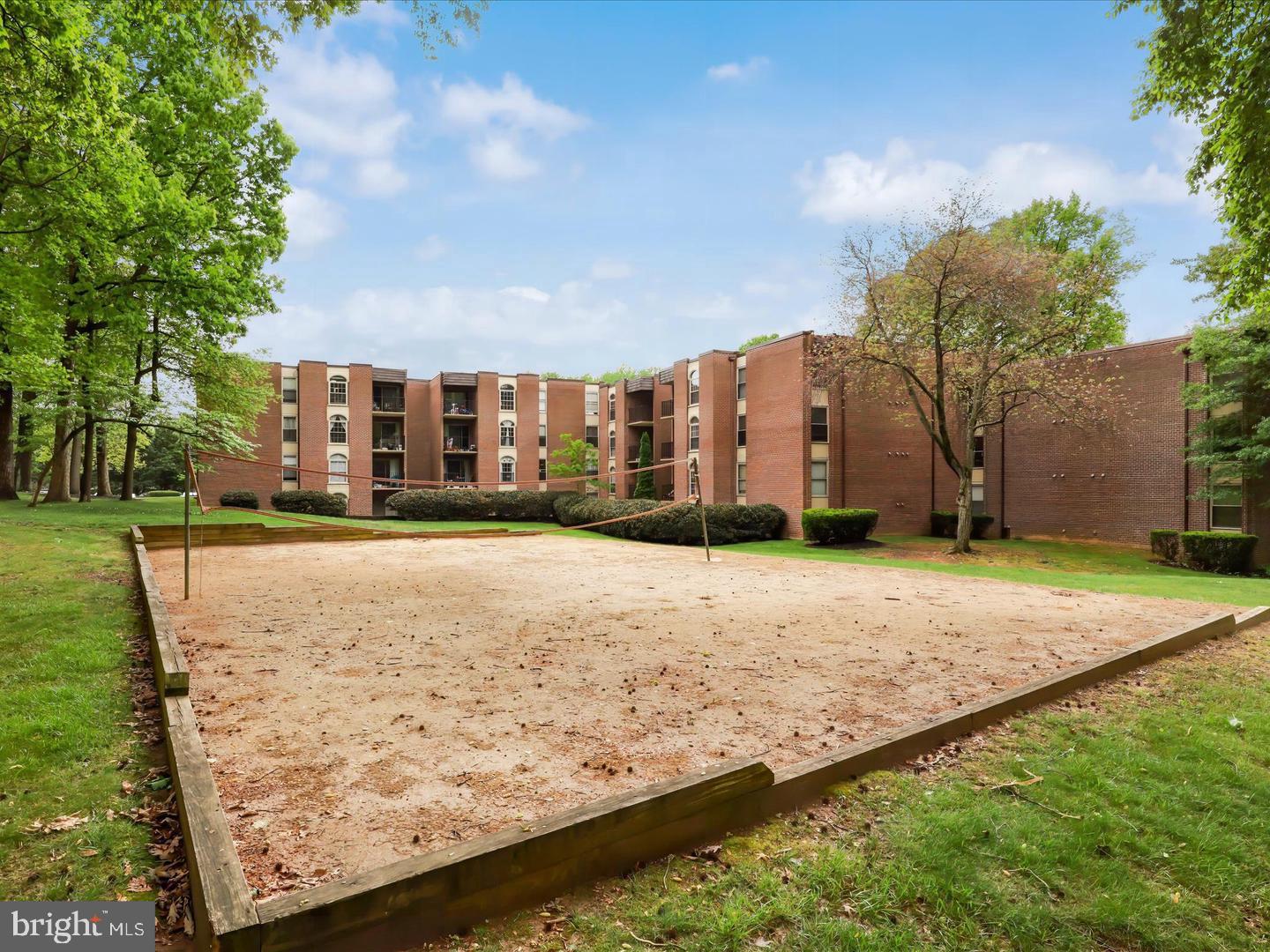 8300 Tobin Road, Unit 23 Annandale, VA 22003 - Photo 25 of 37 a view of a house with a yard and large tree