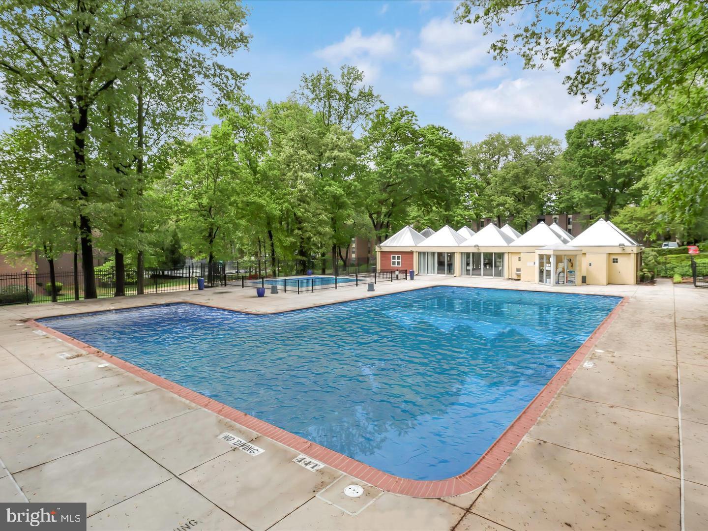 8300 Tobin Road, Unit 23 Annandale, VA 22003 - Photo 31 of 37 a view of a swimming pool with an outdoor space