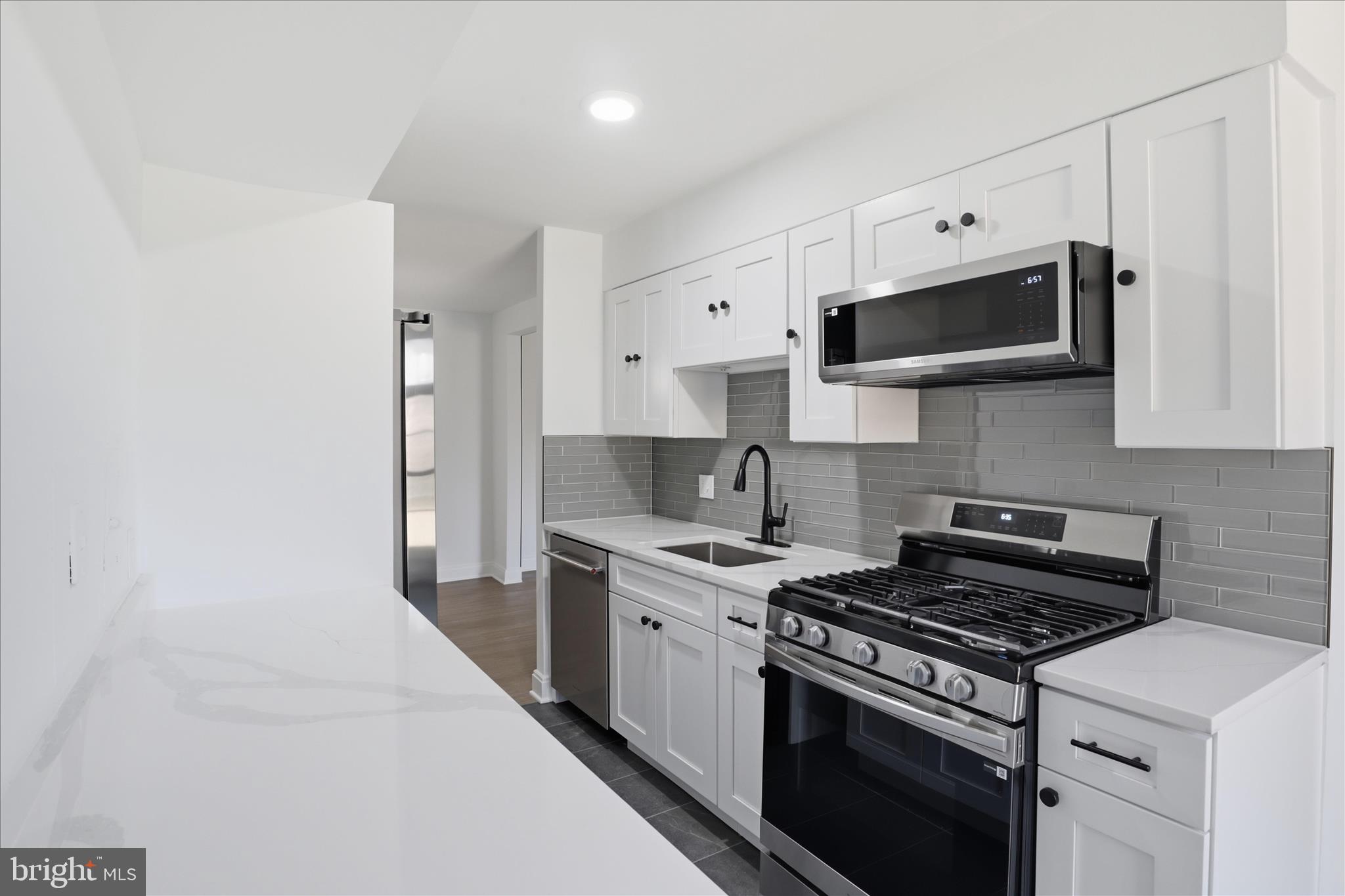 8300 Tobin Road, Unit 23 Annandale, VA 22003 - Photo 6 of 37 a kitchen with stainless steel appliances a sink a stove and cabinets