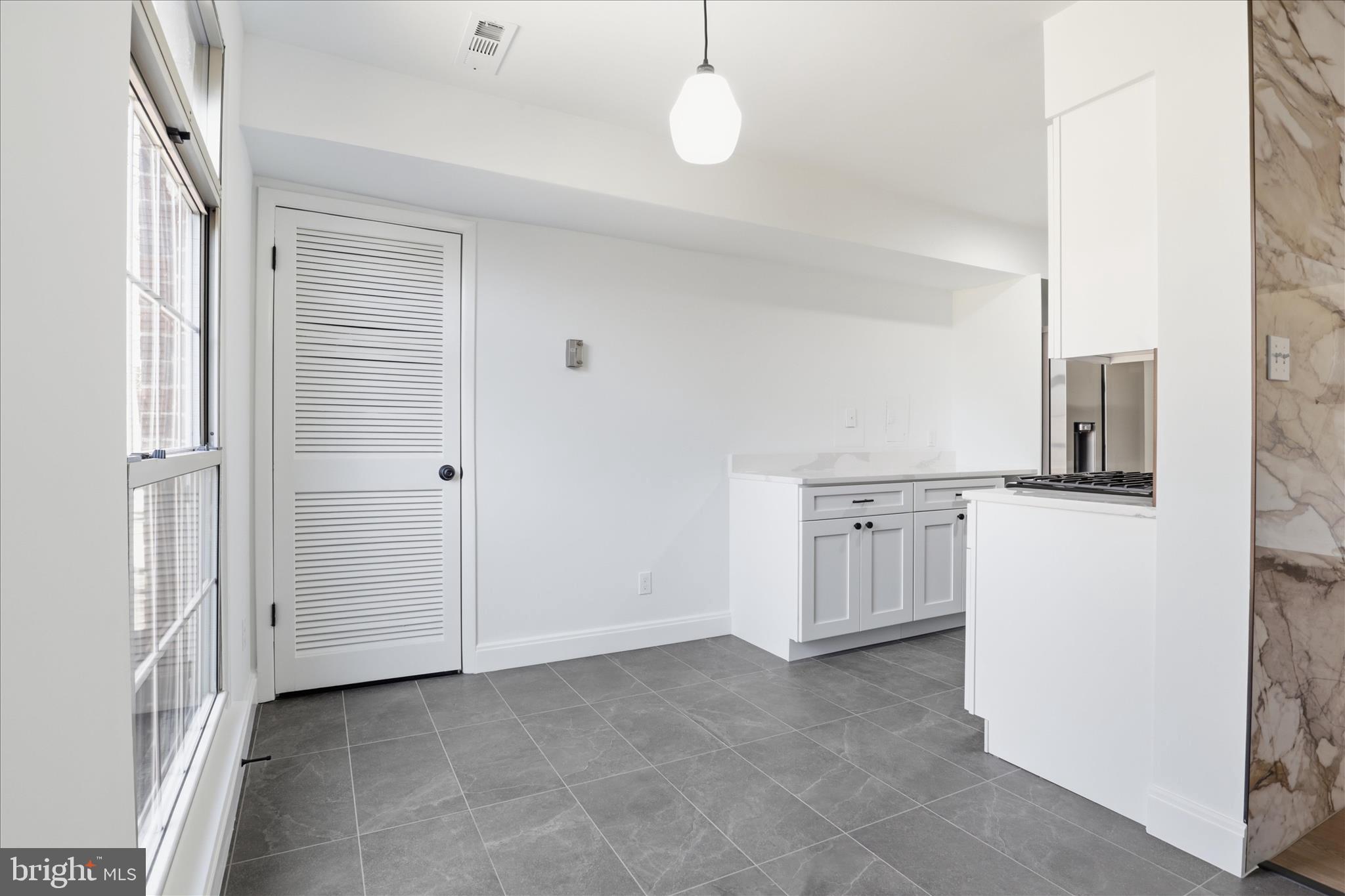 8300 Tobin Road, Unit 23 Annandale, VA 22003 - Photo 7 of 37 a view of a kitchen with refrigerator stove and cabinets
