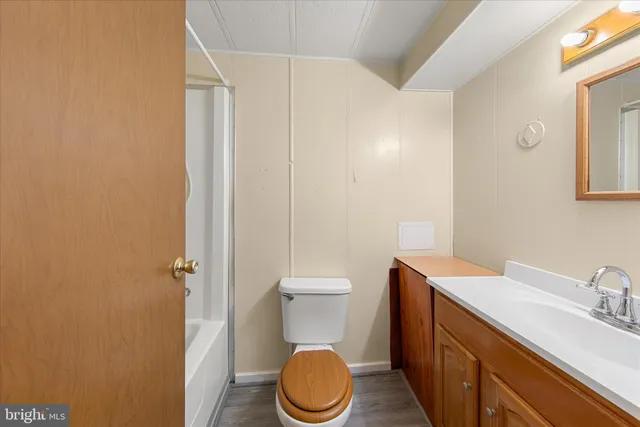 a bedroom with a bed and a chair