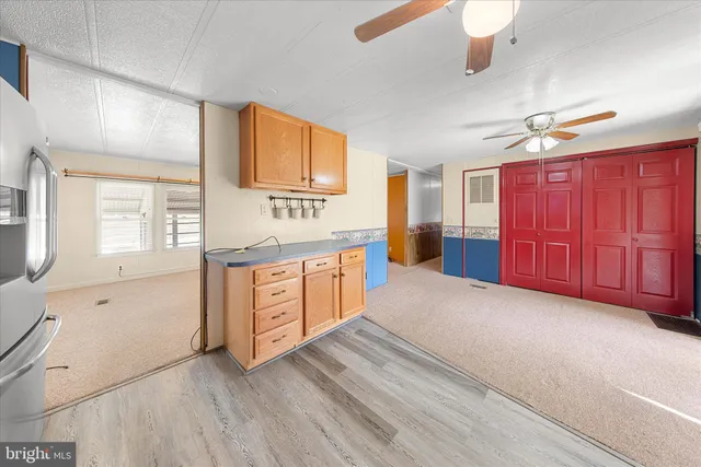 a view of a kitchen with electric appliances