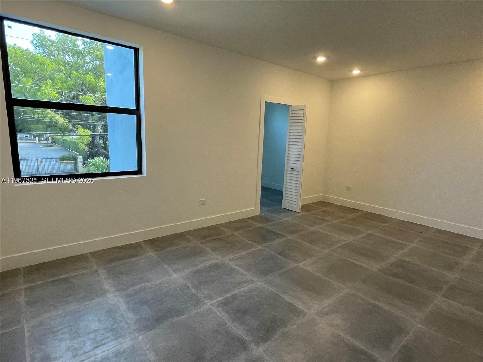 2737 Southwest 2nd Street, Unit 1 Miami, FL 33135 - Photo 15 of 25 a view of an empty room with a window