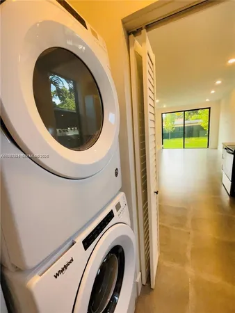 a close view of a utility room with washer and dryer