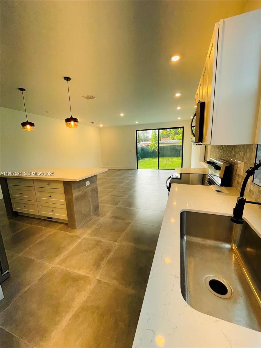 2737 Southwest 2nd Street, Unit 1 Miami, FL 33135 - Photo 20 of 25 a bathroom with a sink and mirror