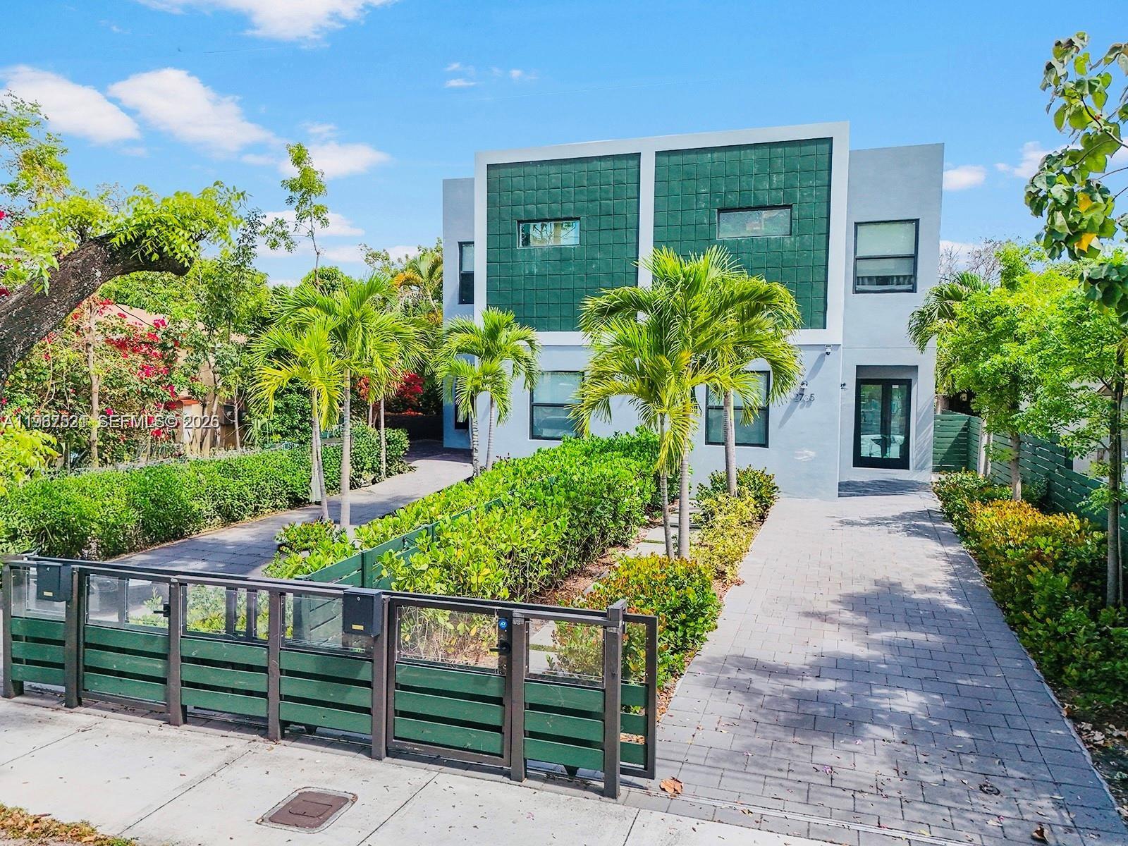 2737 Southwest 2nd Street, Unit 1 Miami, FL 33135 - Photo 25 of 25 a front view of a house with a garden