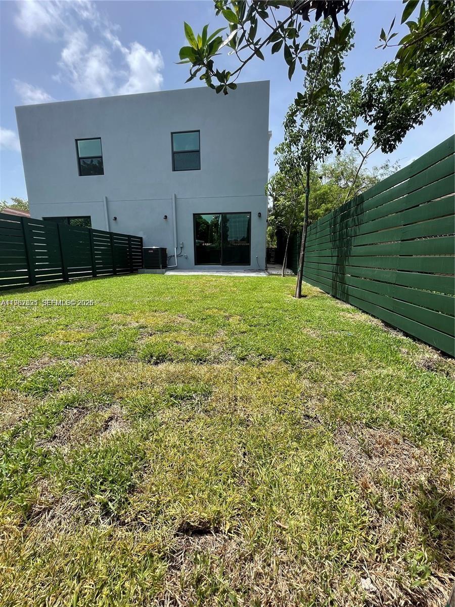 2737 Southwest 2nd Street, Unit 1 Miami, FL 33135 - Photo 7 of 25 a view of a backyard with a garden and entertaining space