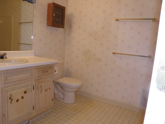 210 J R Boulevard Macon, GA 31220 - Photo 11 of 19 a white toilet sitting next to a bathroom sink