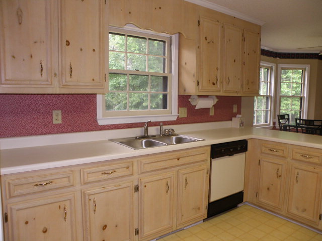 210 J R Boulevard Macon, GA 31220 - Photo 7 of 19 a kitchen with white cabinets and sink
