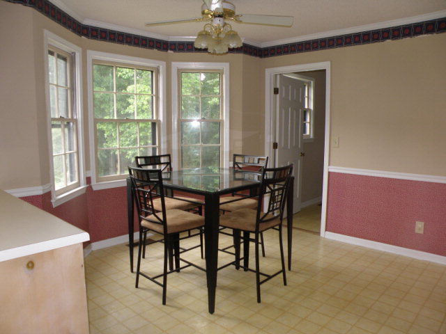 210 J R Boulevard Macon, GA 31220 - Photo 8 of 19 a dining room with furniture a chandelier and window