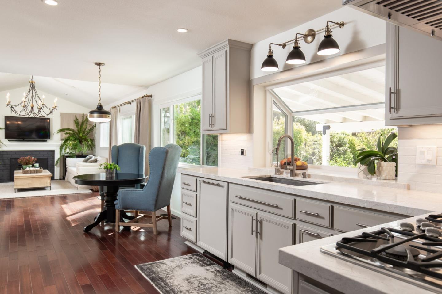 2 Black Tail Lane Monterey, CA 93940 - Photo 12 of 32 a kitchen with sink cabinets and dining table with wooden floor