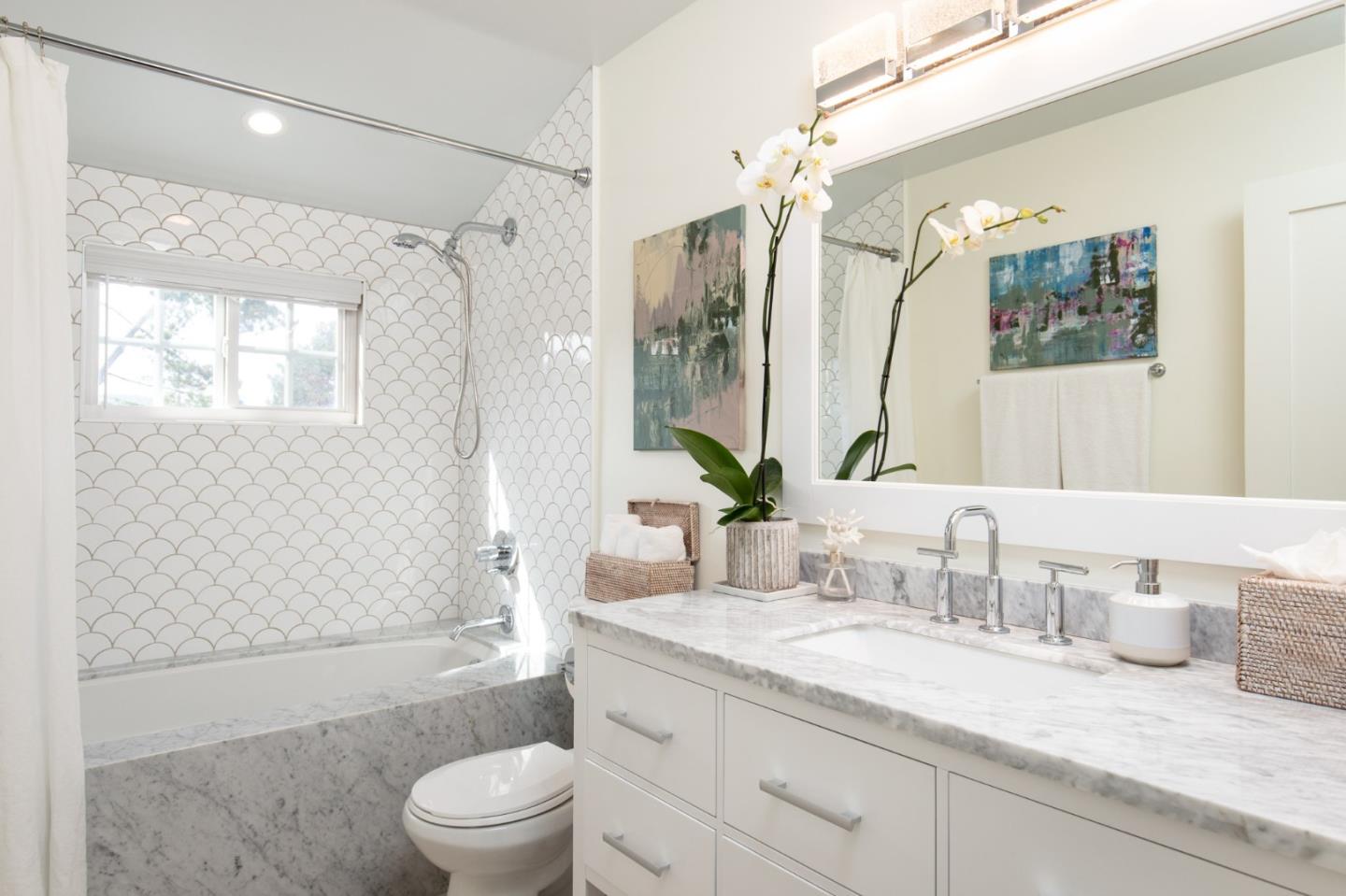 2 Black Tail Lane Monterey, CA 93940 - Photo 25 of 32 a bathroom with a granite countertop sink toilet a large mirror a shower and a bathtub