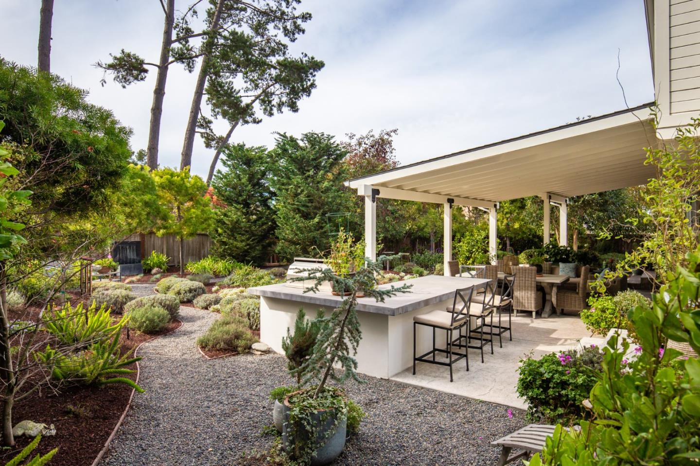 2 Black Tail Lane Monterey, CA 93940 - Photo 27 of 32 a view of a patio with table and chairs potted plants and floor to ceiling window and potted plants