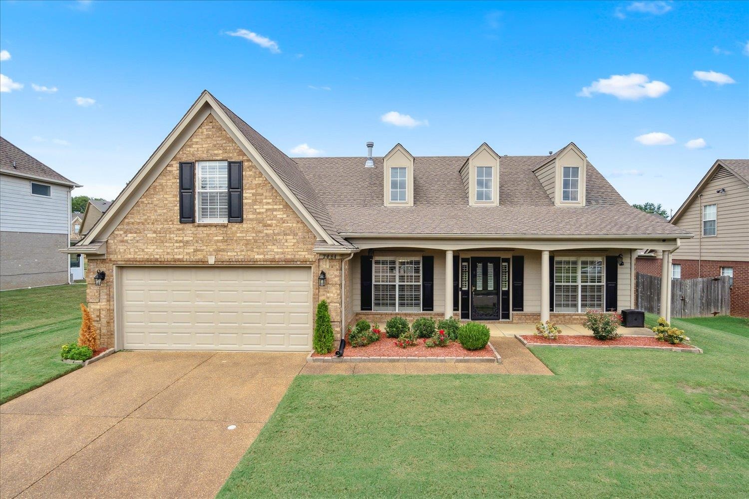 7464 Britt Way Memphis, TN 38125 - Photo 1 of 29 a front view of a house with a yard