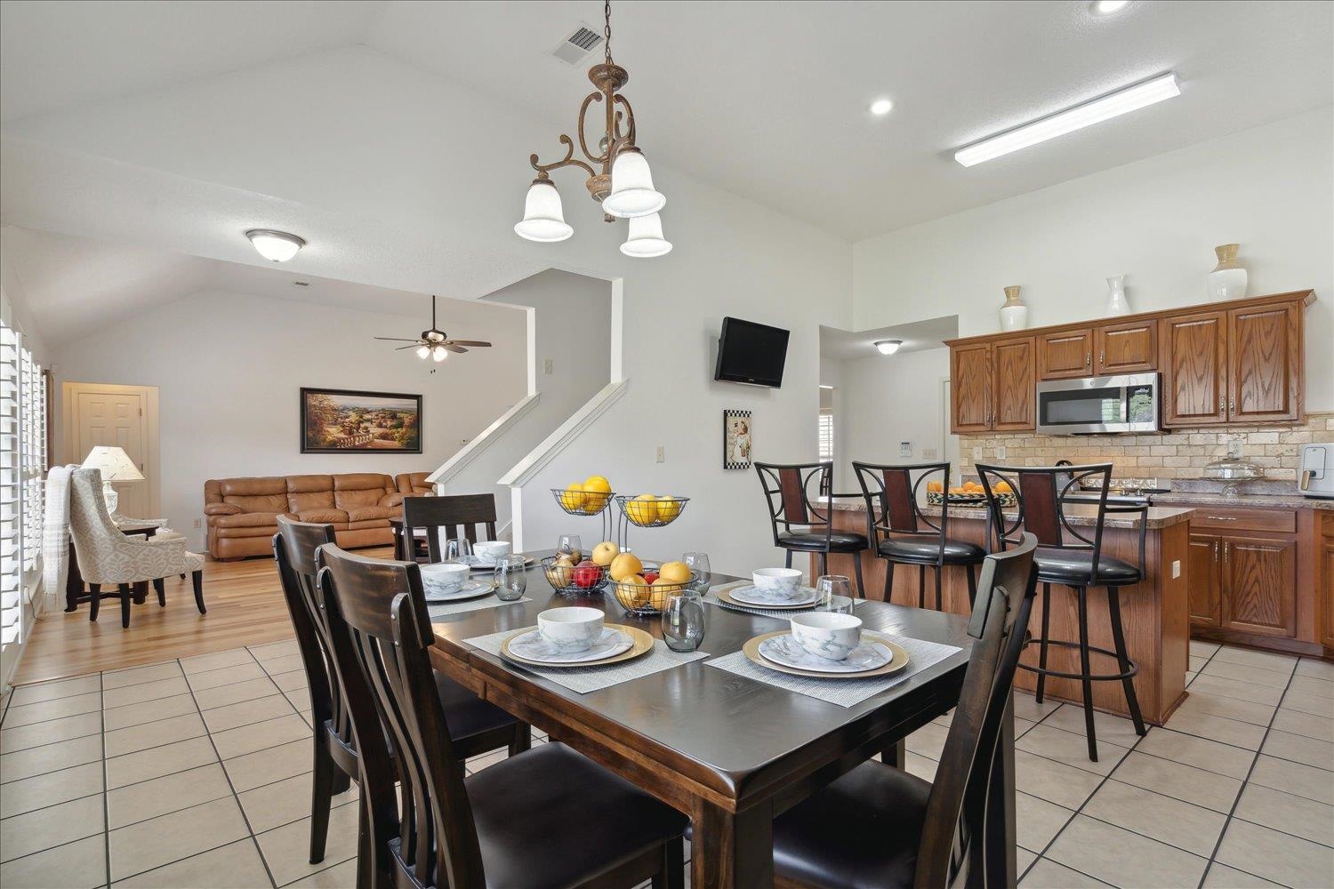 7464 Britt Way Memphis, TN 38125 - Photo 14 of 29 a view of a dining area with furniture and a chandelier