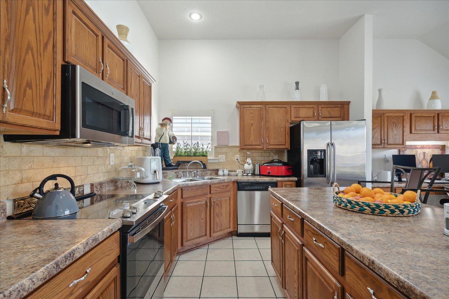 7464 Britt Way Memphis, TN 38125 - Photo 17 of 29 a kitchen with stainless steel appliances granite countertop a sink stove and refrigerator
