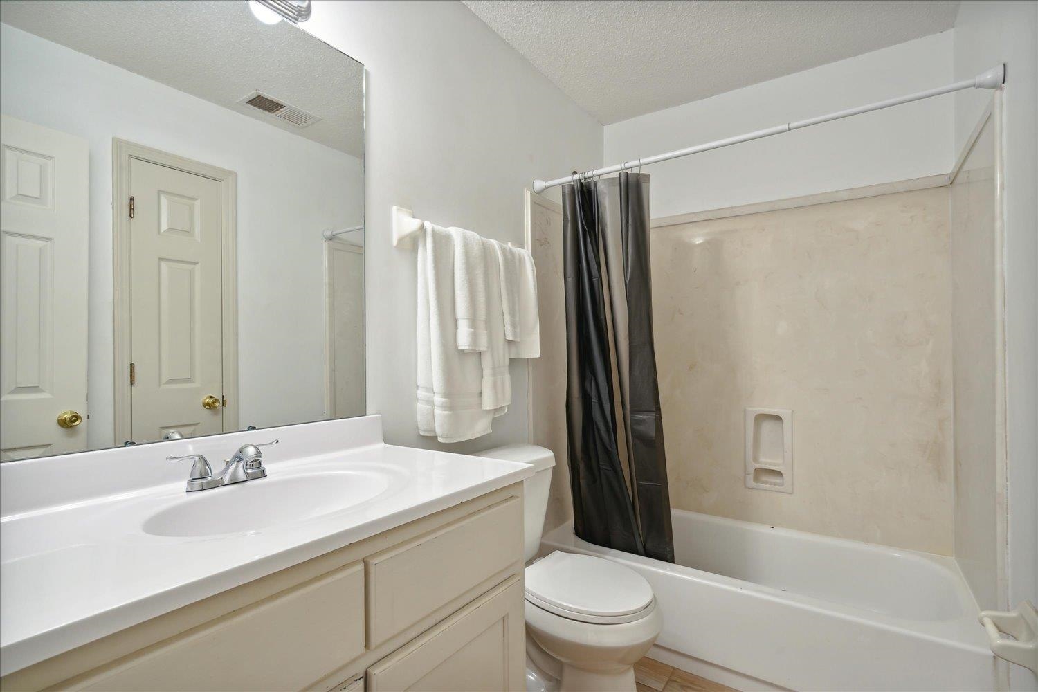 7464 Britt Way Memphis, TN 38125 - Photo 23 of 29 a bathroom with a granite countertop sink toilet and shower
