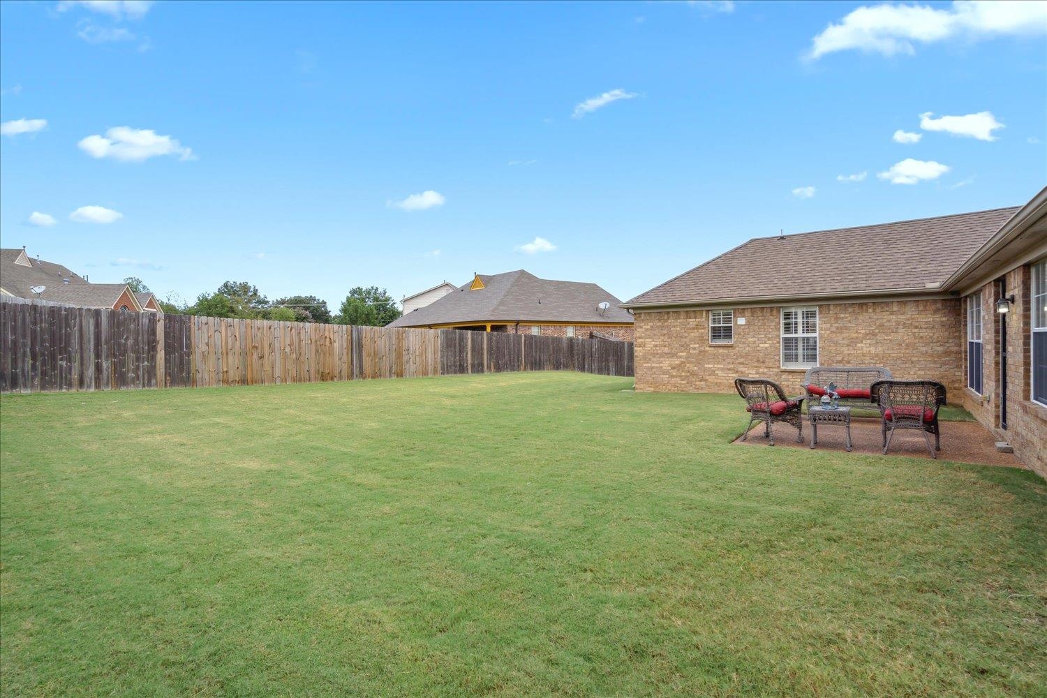 7464 Britt Way Memphis, TN 38125 - Photo 27 of 29 a view of a house with a backyard and sitting area
