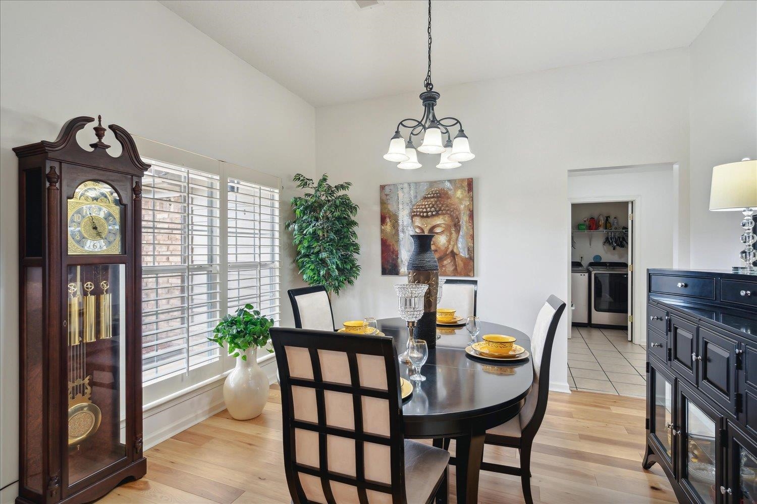 7464 Britt Way Memphis, TN 38125 - Photo 7 of 29 a view of a dining room with furniture window and wooden floor